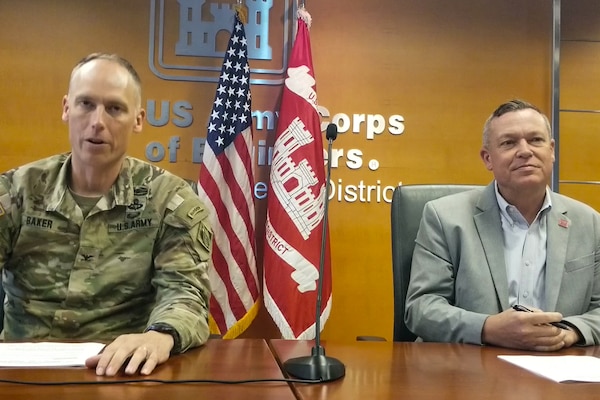 Col. Andrew Baker (left), LA District commander, and Justin Gay (right), LA District deputy engineer, lead the End-of-Year Celebration – that highlighted the year’s accomplishments – Oct. 17 at the LA District Headquarters in downtown Los Angeles.