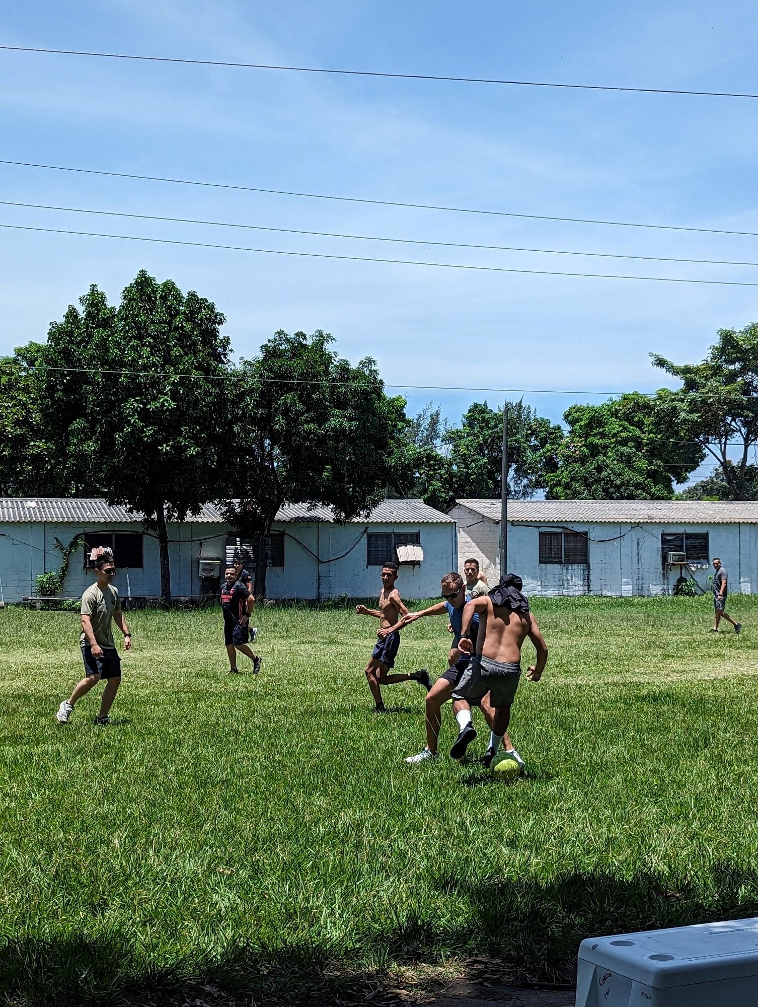 Members of the 571 Mobility Support Advisory Squadron stationed at Travis Air Force Base, California, play soccer with Fuerza Aérea Salvadoreña Airmen during El Salvador Mobile Training Team 23-22, Aug. 30, 2023, Ilopango International Airport, San Salvador.