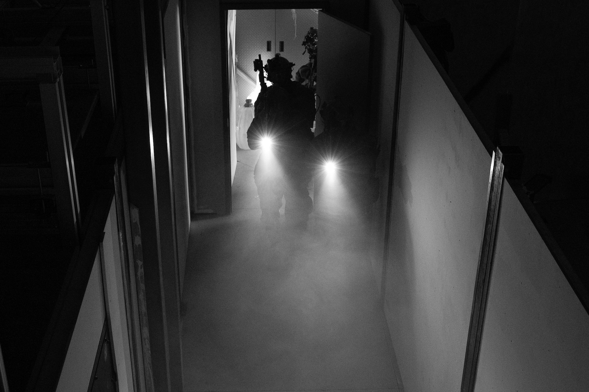 Special Operations Forces infiltrate a shoot-house during a training exercise at Schriever Space Force Base, Colorado, Oct. 19, 2023. Joint operation trainings are vital to Airmen, Soldiers and Guardians to prepare them for modern-day conflict. (U.S. Space Force photo by Staff Sgt. Natalie Rubenak).