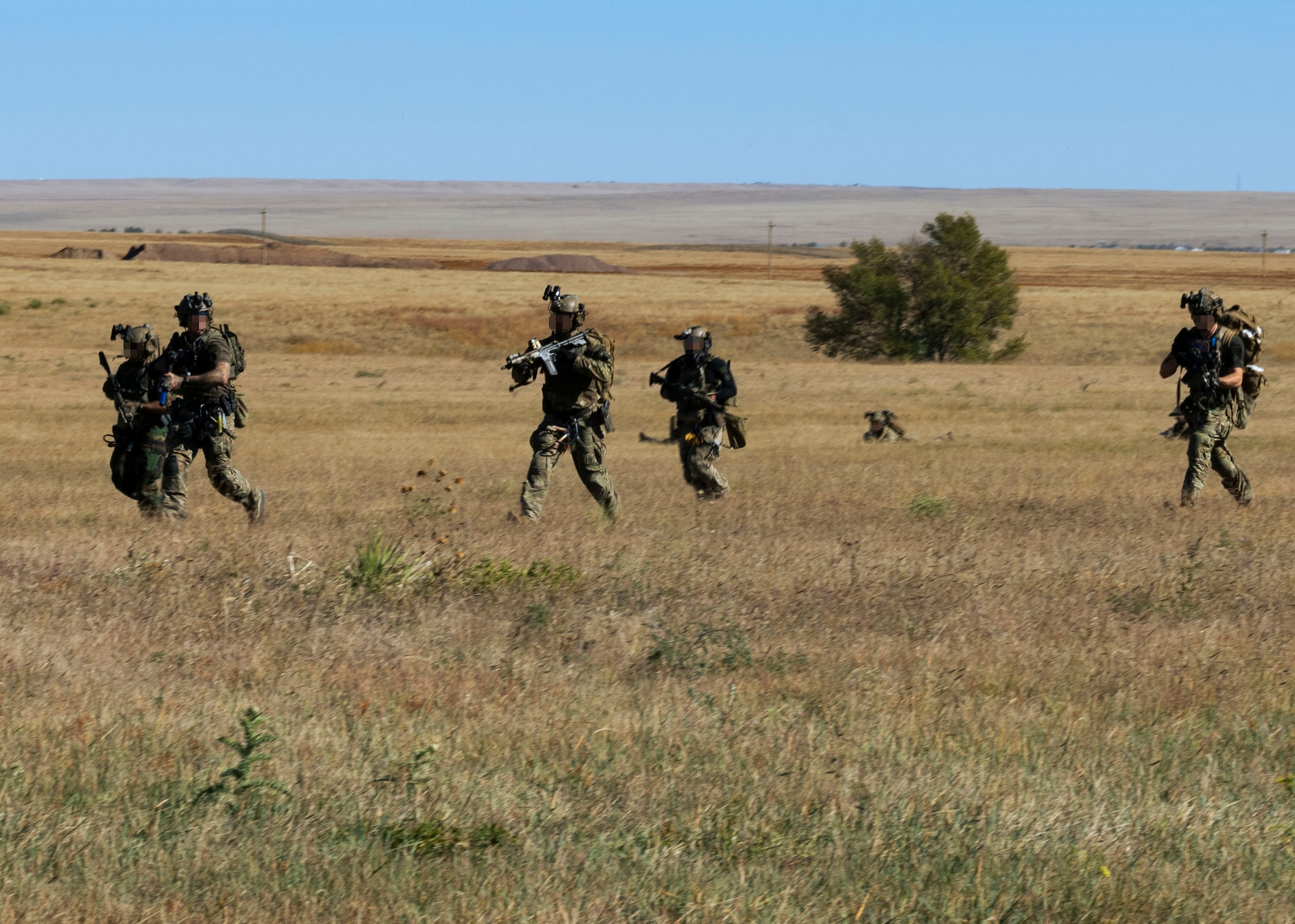Special Operations Forces make their way towards their first objective on Schriever Space Force Base, Colorado, Oct. 19, 2023. SOF and a tier 1 NATO mission partner conducted a helicopter assault force training exercise with the 50th Security Forces Squadron. (U.S. Space Force photo by Senior Airman Kaitlin Castillo)
