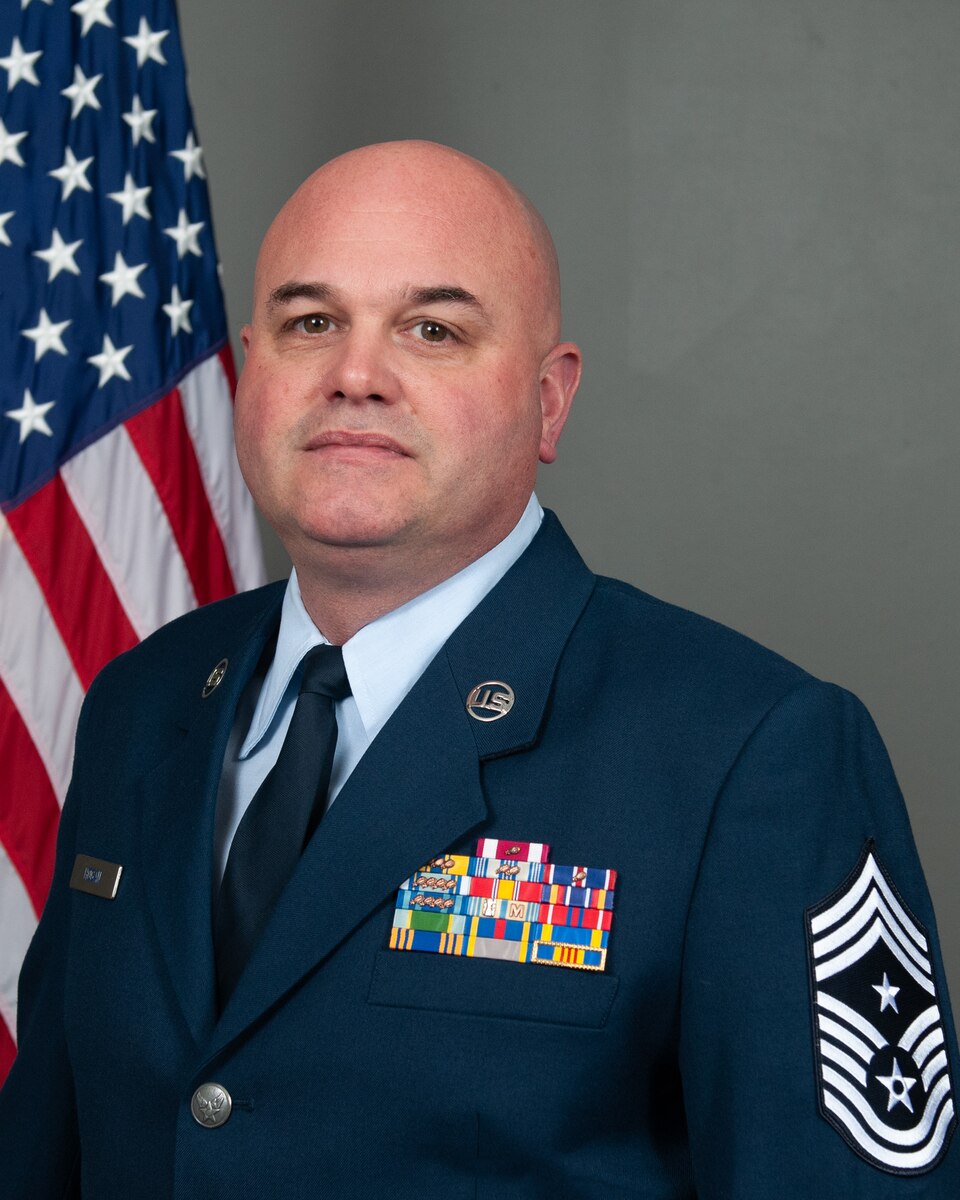 Official photo of Chief Master Sgt. David Hogan in the Air Force dress blue uniform