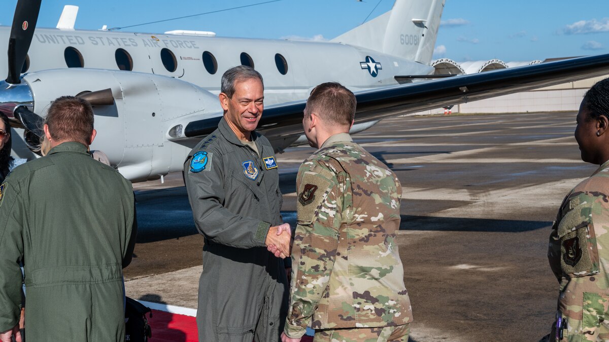 Gen. Ken Wilsbach is greeted by Chief Master Sgt. Steven Creek.