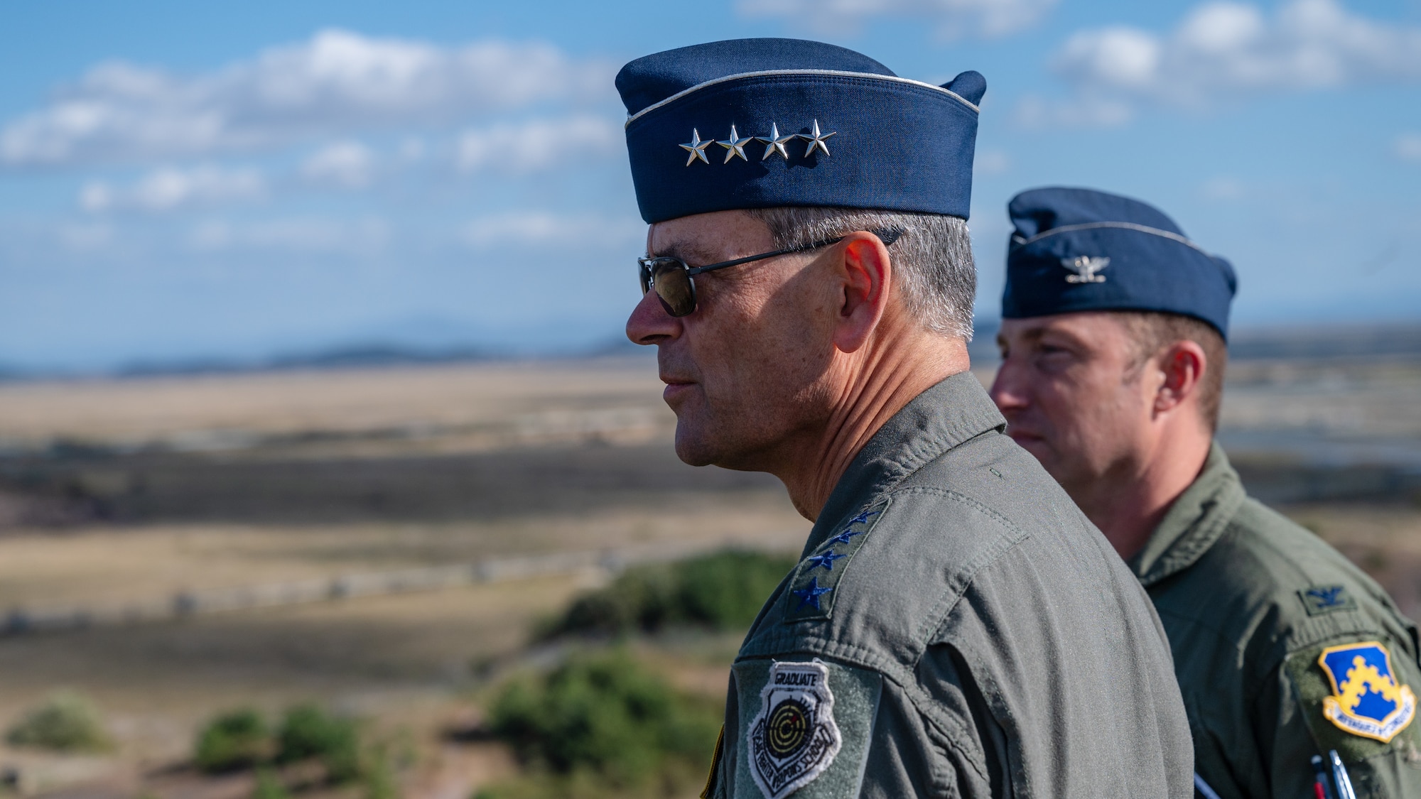 Gen. Ken Wilsbach and Col. Jeffrey Shulman look over the flightline during a visit to Kunsan Air Base.