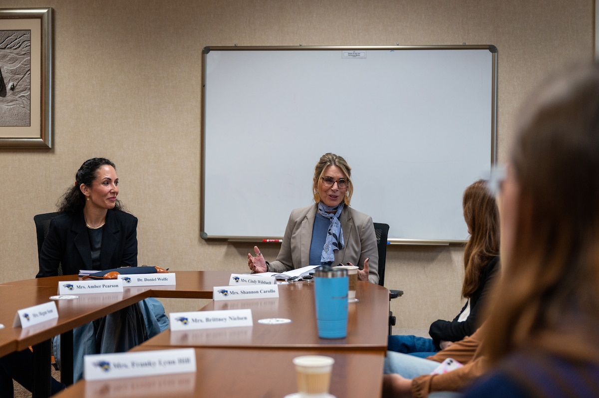 Dr. Doniel Wolfe and Cindy Wilsbach share insights during their discussion with non-command sponsored spouses.