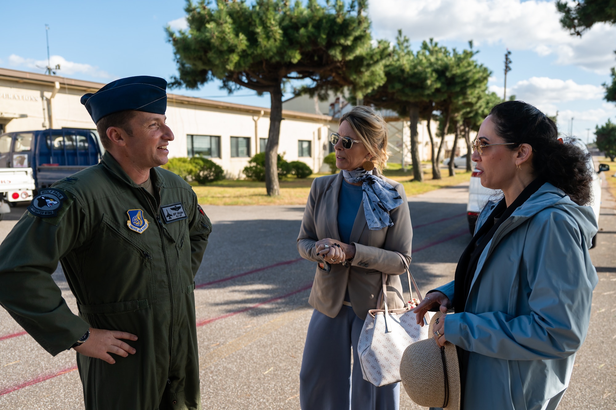 Col. Jeffrey D. Shulman speaks to Cindy Wilsbach and Dr. Doniel Wolfe.