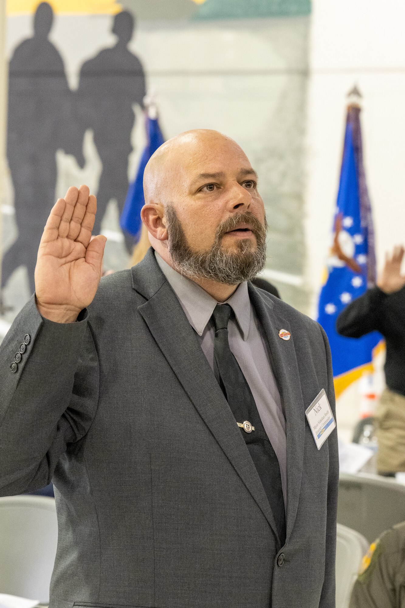 Nickolaus Smith, Clayton, Delaware mayor, recites the Honorary Commander Oath during the 2024 HCC Induction Ceremony at Dover Air Force Base, Delaware, Oct. 20, 2023. Established in 1992, the Dover AFB HCC program is a community outreach effort that builds upon the great relationships between local civic leaders and Dover AFB personnel. (U.S. Air Force photo by Mauricio Campino)
