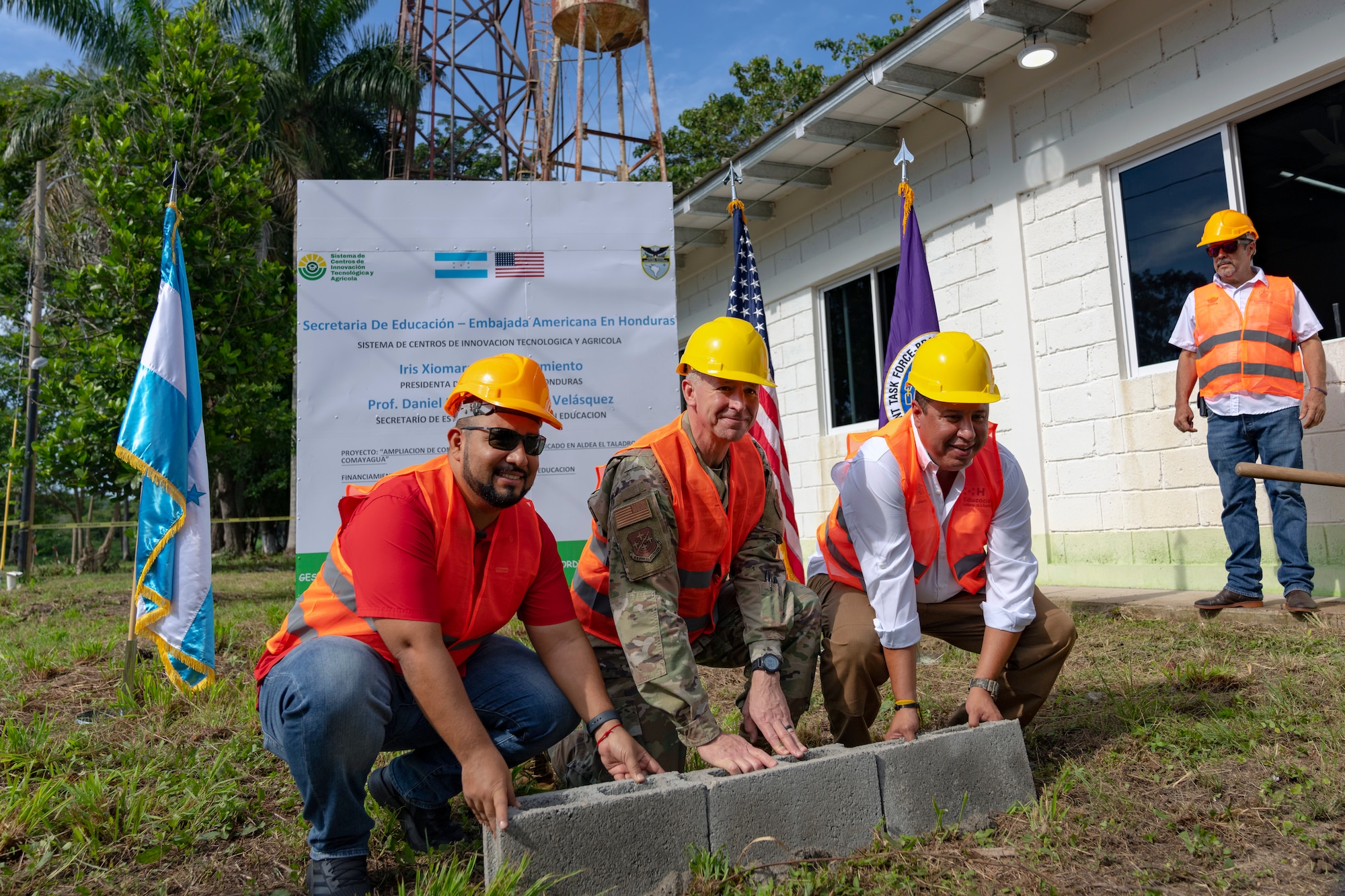 From left to right, Honduras Minister of Education, Professor Daniel Esponda, U.S. Maj. Gen. Evan Pettus, 12th Air Force (Air Forces Southern) commander, and Honduras Deputy Minister of Education for School Construction and Reconstruction, Juan Carlos Coello, participate in a bricklaying ceremony at the System of Technological and Agricultural Innovation (SCITA) in Comayagua, Honduras, Aug. 4, 2023. U.S. Southern Command's Humanitarian Assistance Program donated $25,000 to SCITA for improvements to infrastructure that are key to ensuring quality education for Hondurans. (U.S. Air Force photo by Tech. Sgt. Rachel Maxwell)