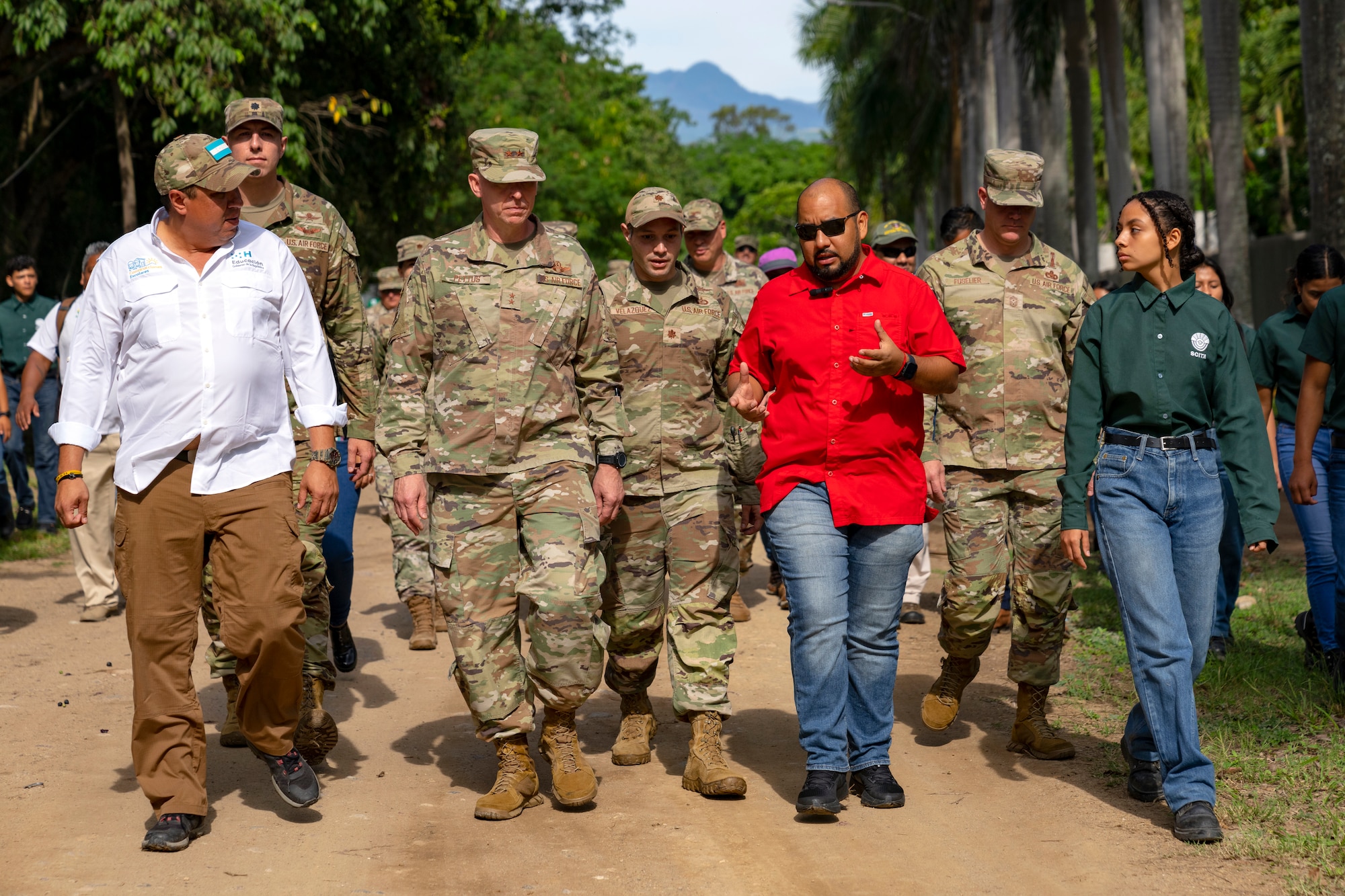 Honduras Minister of Education, Professor Daniel Esponda, center-right, leads U.S. Maj. Gen. Evan Pettus, 12th Air Force (Air Forces Southern) commander, center left, on a tour of the campus grounds for the System of Technological and Agricultural Innovation (SCITA) in Comayagua, Honduras, Aug. 4, 2023. U.S. Southern Command's Humanitarian Assistance Program donated $25,000 to SCITA for improvements to infrastructure that are key to ensuring quality education for Hondurans. (U.S. Air Force photo by Tech. Sgt. Rachel Maxwell)