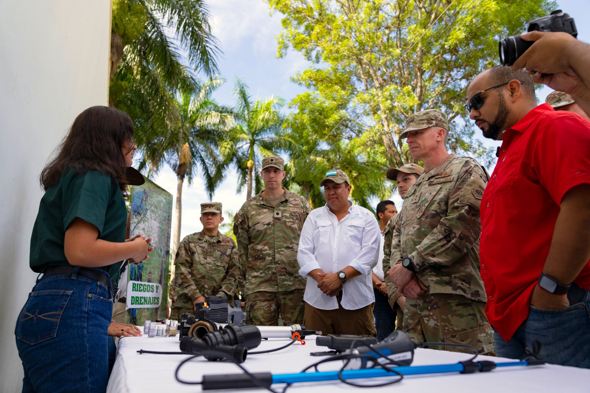 Honduran Minister of Education, Professor Daniel Esponda, right, and U.S. Maj. Gen. Evan Pettus, 12th Air Force (Air Forces Southern) commander, second from right, listen to a student describe irrigation and drainage concepts at the System of Technological and Agricultural Innovation (SCITA) in Comayagua, Honduras, Aug. 4, 2023. U.S. Southern Command's Humanitarian Assistance Program donated $25,000 to SCITA for improvements to infrastructure that are key to ensuring quality education for Hondurans. (U.S. Air Force photo by Tech. Sgt. Rachel Maxwell)