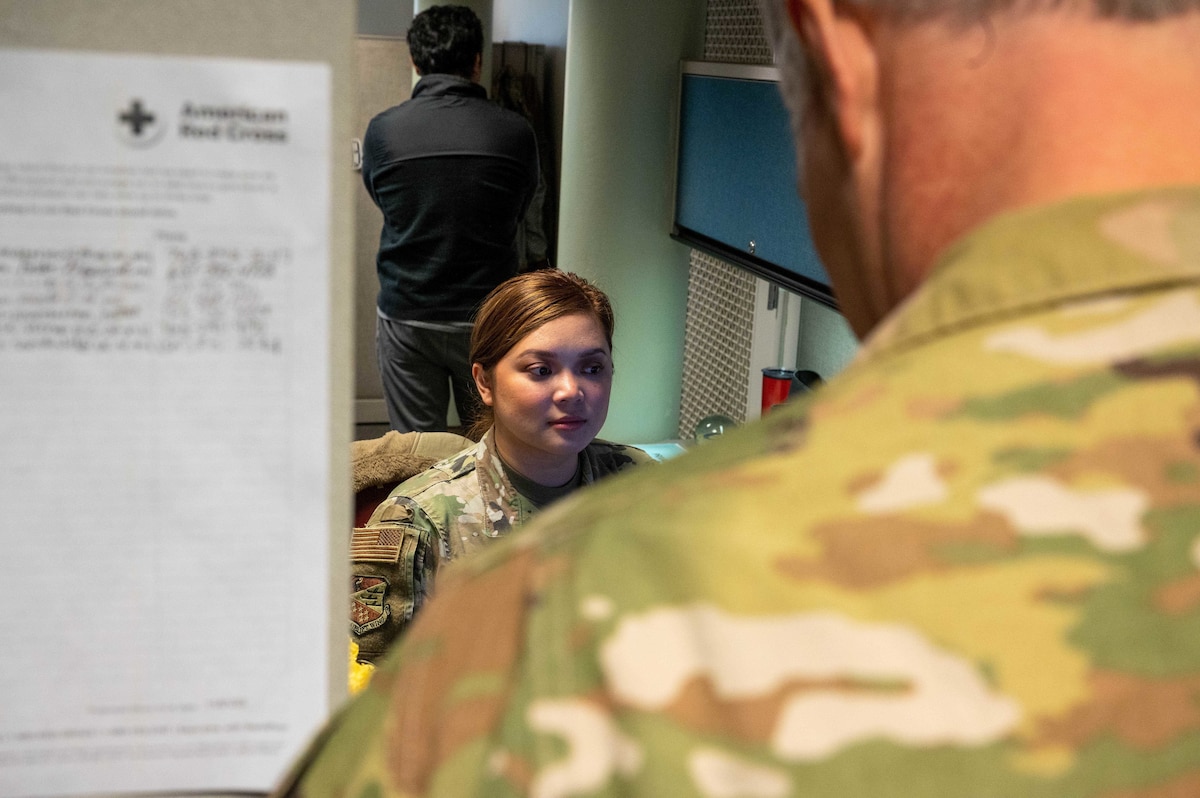 Staff Sgt. Kim Franseen, a 934th Airlift Wing Financial Management technician, helps an Airmen with his travel voucher at Minneapolis-St. Paul Air Reserve Station, Minnesota, Oct. 14, 2023. The Air Force Reserve switched from the Reserve Travel System to the Defense Travel System at the beginning of the fiscal year. (U.S. Air Force photo by Senior Airman Matthew Reisdorf)