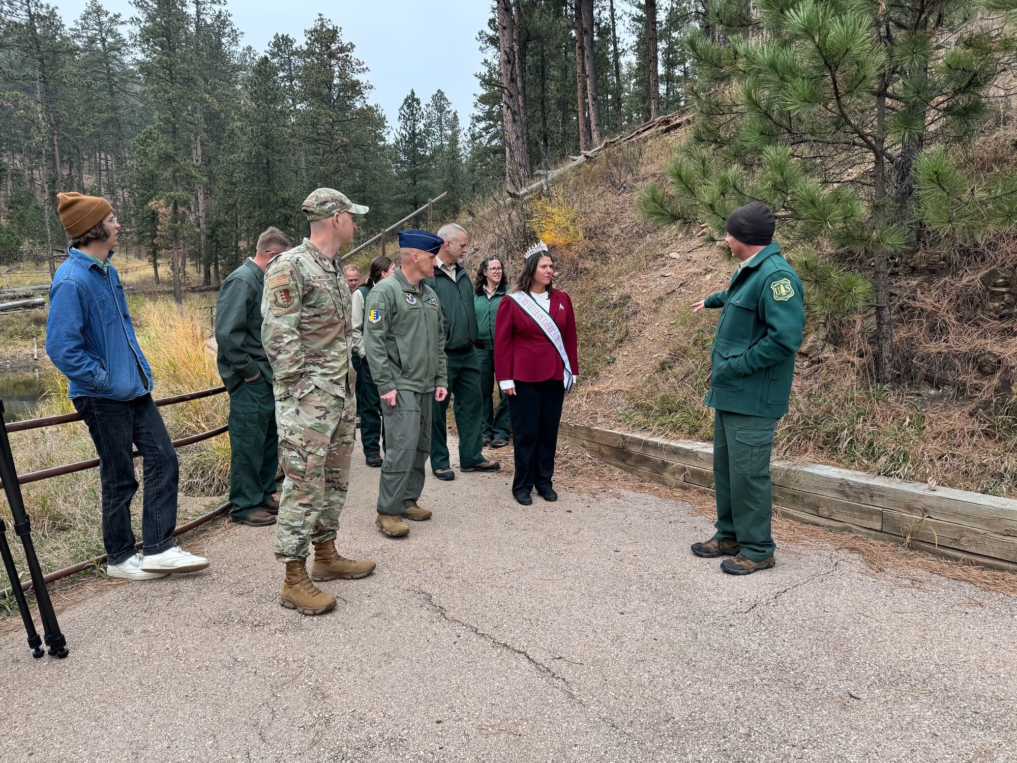 Ben Schumaker, right, Black Hills National Forest Recreation Staff Officer for Mystic Ranger District, leads Ellsworth Air Force Base leadership on a walking tour of Veteran’s Point Trail on the Pactola Reservoir, South Dakota, October 24, 2023.