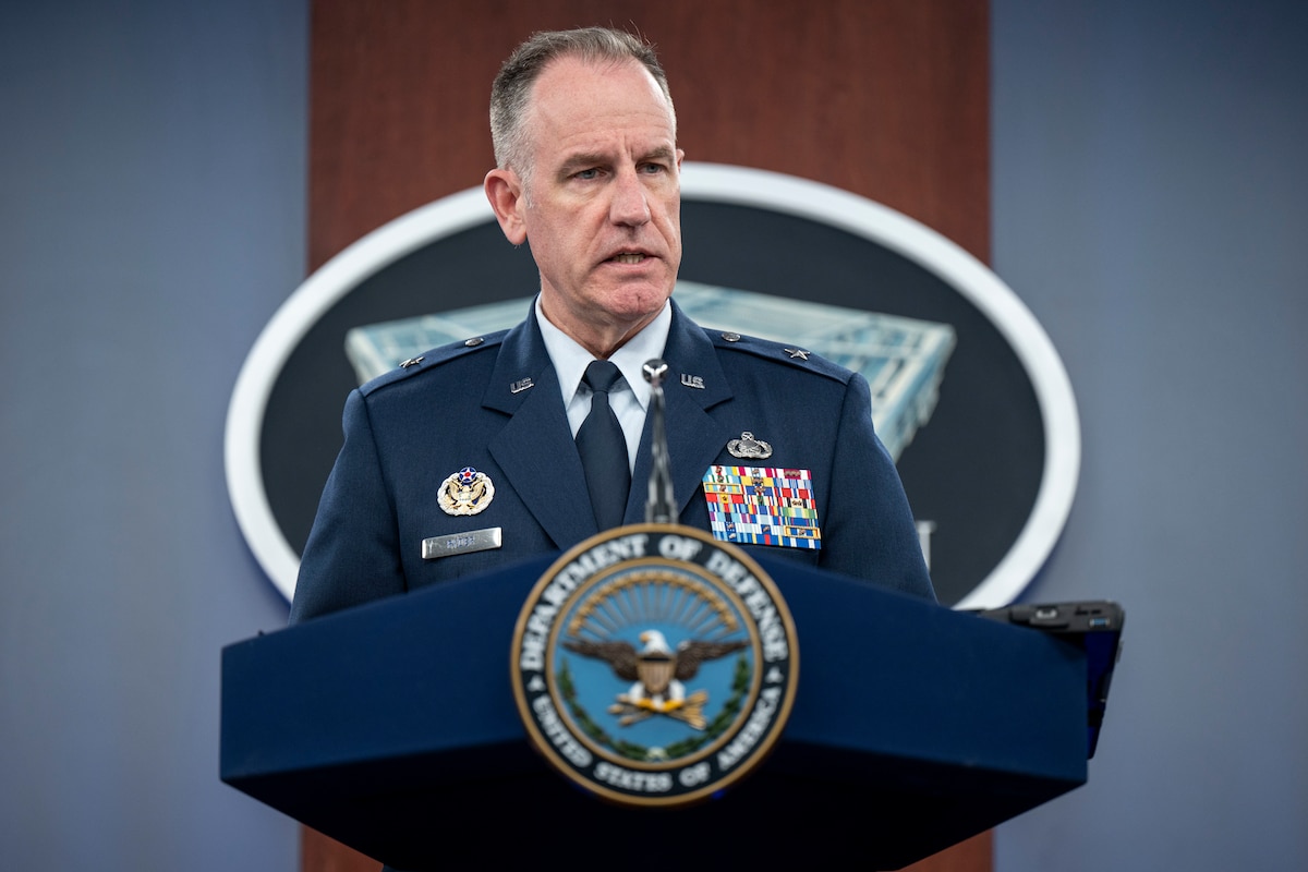 A man speaks from a podium.