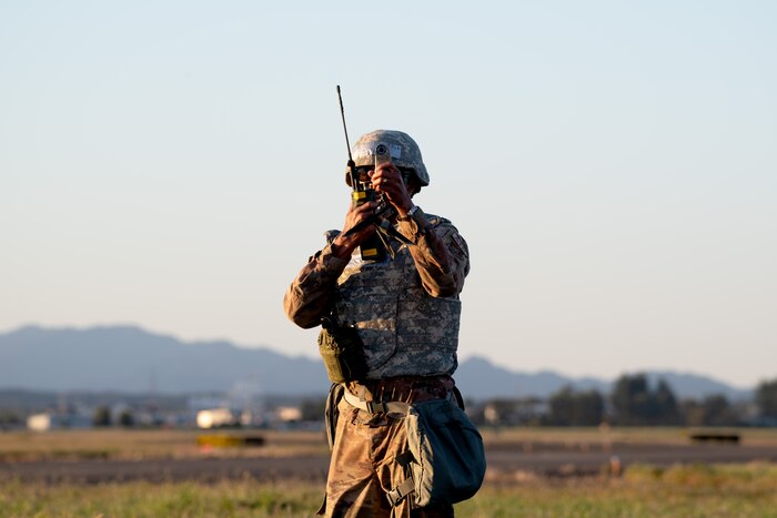 A man stands with a radio
