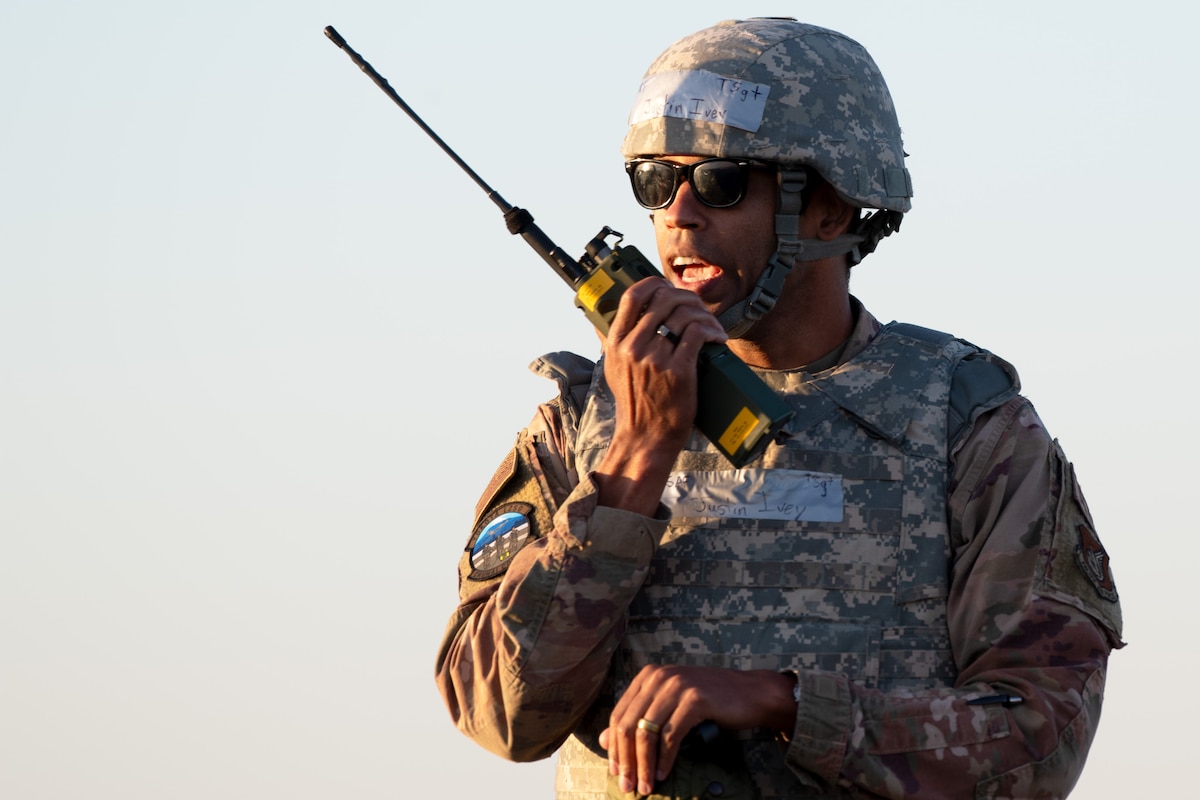 A man talks into a radio