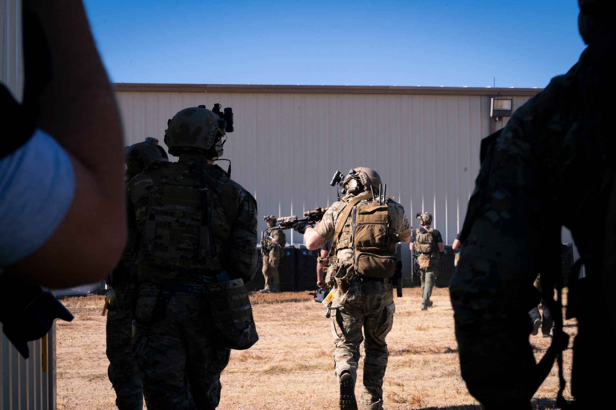 A Special Operations Forces soldier raids a shoot-house during a training exercise with the 50th Security Forces Squadron and a tier 1 NATO mission partner on Schriever Space Force Base, Colorado, Oct. 19, 2023. This exercise increased interoperability and allowed for the 50th SFS to begin employing the Agile Combat Employment concept. (U.S. Space Force photo by Senior Airman Kaitlin Castillo)