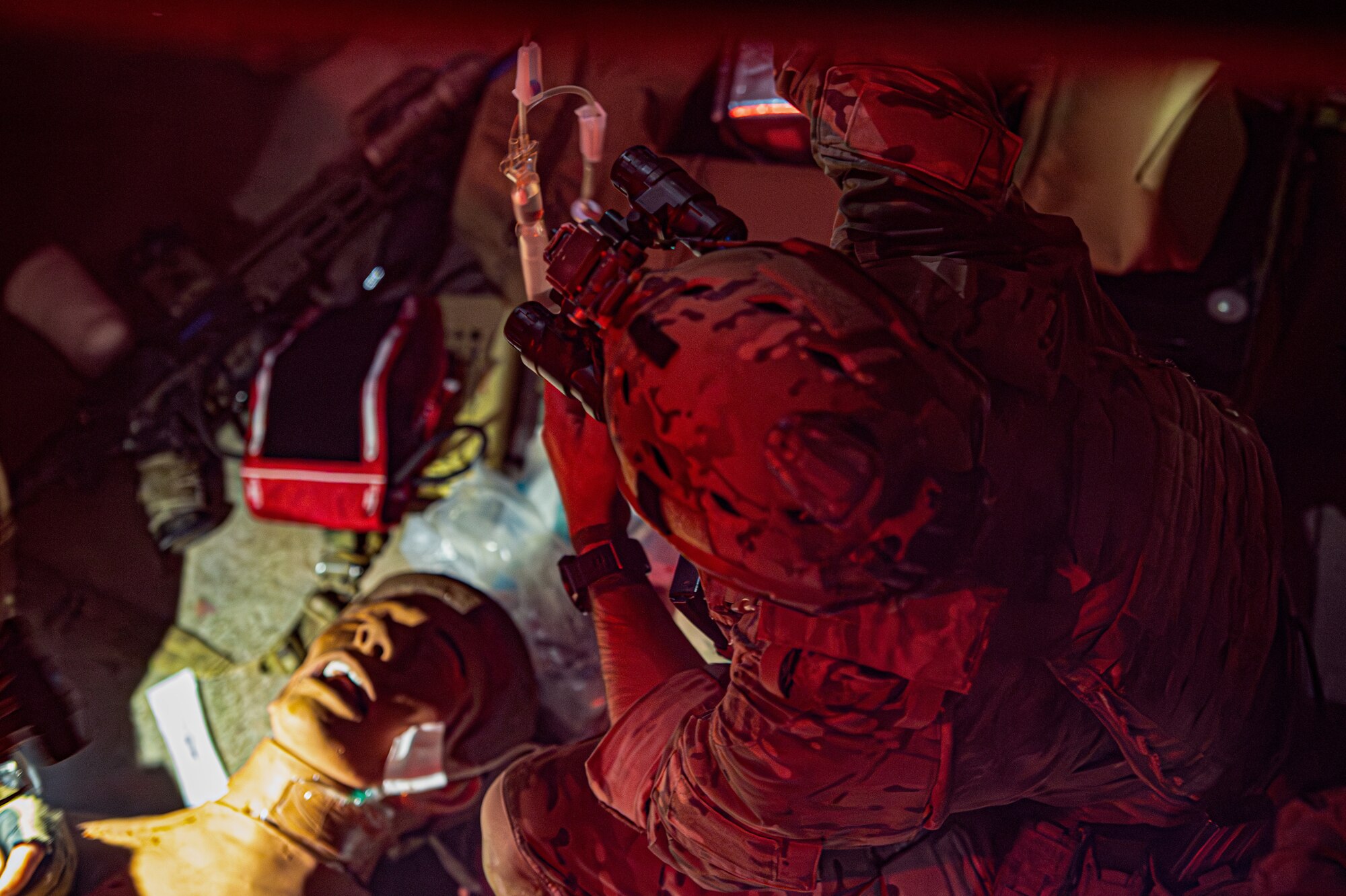 A Special Operations Forces soldier provides medical care to a training dummy during a training exercise with a tier 1 NATO mission partner at Schriever Space Force Base, Colorado, Oct. 19, 2023. Security Forces from four different installations partnered with a tier 1 NATO mission partner and SOF for an air assault training exercise to demonstrate interoperability and actualize the Agile Combat Employment construct. (U.S. Space Force photo by Tiana Williams)