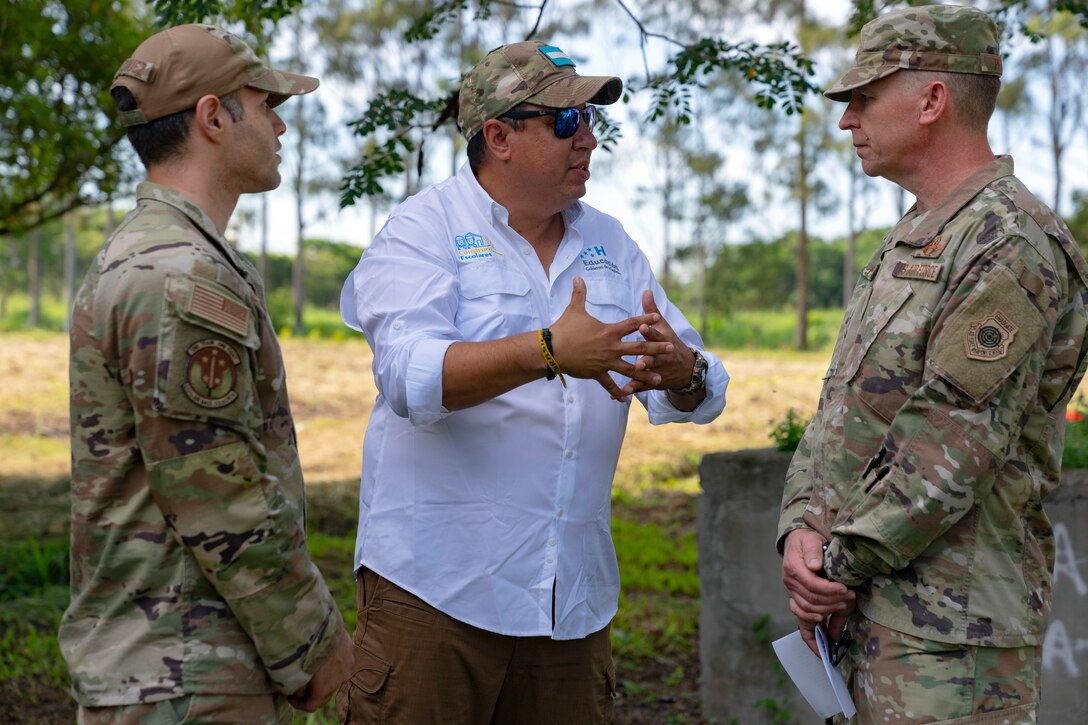 Honduras Deputy Minister of Education for School Construction and Reconstruction, Juan Carlos Coello, center, speaks with U.S. Maj. Gen. Evan Pettus, 12th Air Force (Air Forces Southern) commander, right, during an inauguration ceremony at the System of Technological and Agricultural Innovation (SCITA) in Comayagua, Honduras, Aug. 4, 2023. AFSOUTH remains committed to shared values with partner nations in achieving responsible stewardship of the environment in a shared neighborhood. (U.S. Air Force photo by Tech. Sgt. Rachel Maxwell)