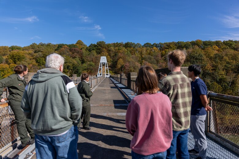 In a convergence of academia and real-world engineering, a group of students from the University of Pittsburgh’s Hydrologic Analysis and Design course explored the Conemaugh River Dam to expand their engineer learning beyond conventional classroom boundaries. University of Pittsburgh students look toward the far side of the Conemaugh River Dam as April Richards, a park ranger with the U.S. Army Corps of Engineers Pittsburgh District, explains the pigeon control systems in place at the dam site in Saltsburg, Pennsylvania, Oct. 13, 2023.