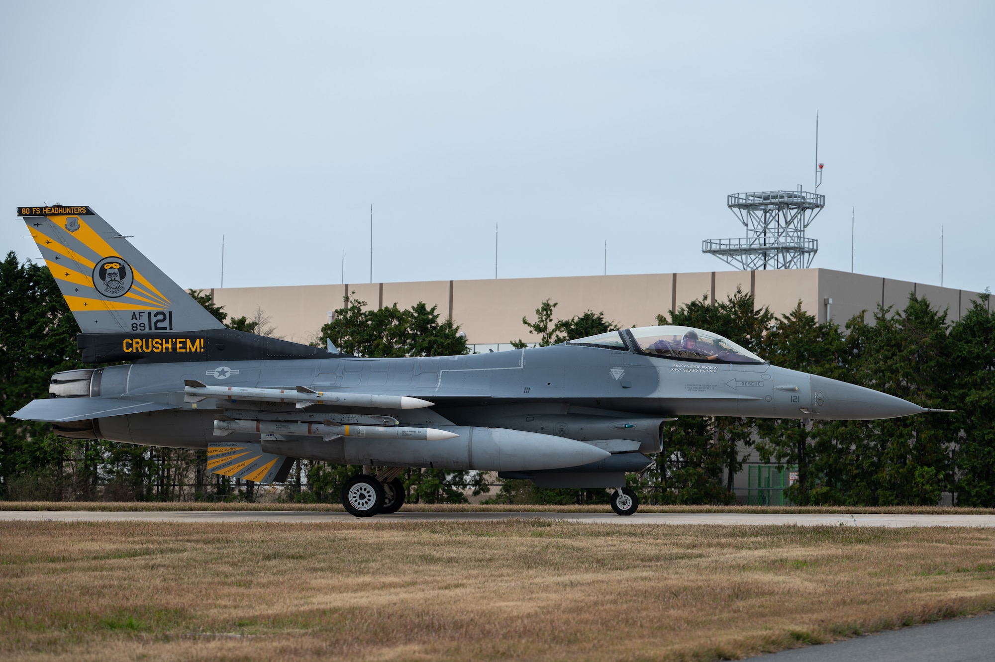 A U.S. Air Force F-16 Fighting Falcon taxis on the runway upon mission return