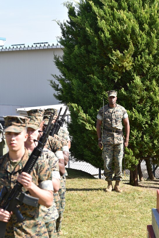 Sergeant Nicholas Smith prepares CATC Camp Fuji Marines to march away from the 1979 Fire Memorial ceremony. (U.S. Marine Corps photo by Song Jordan)