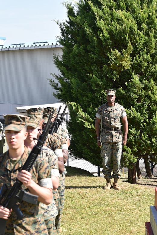 Sergeant Nicholas Smith prepares CATC Camp Fuji Marines to march.
