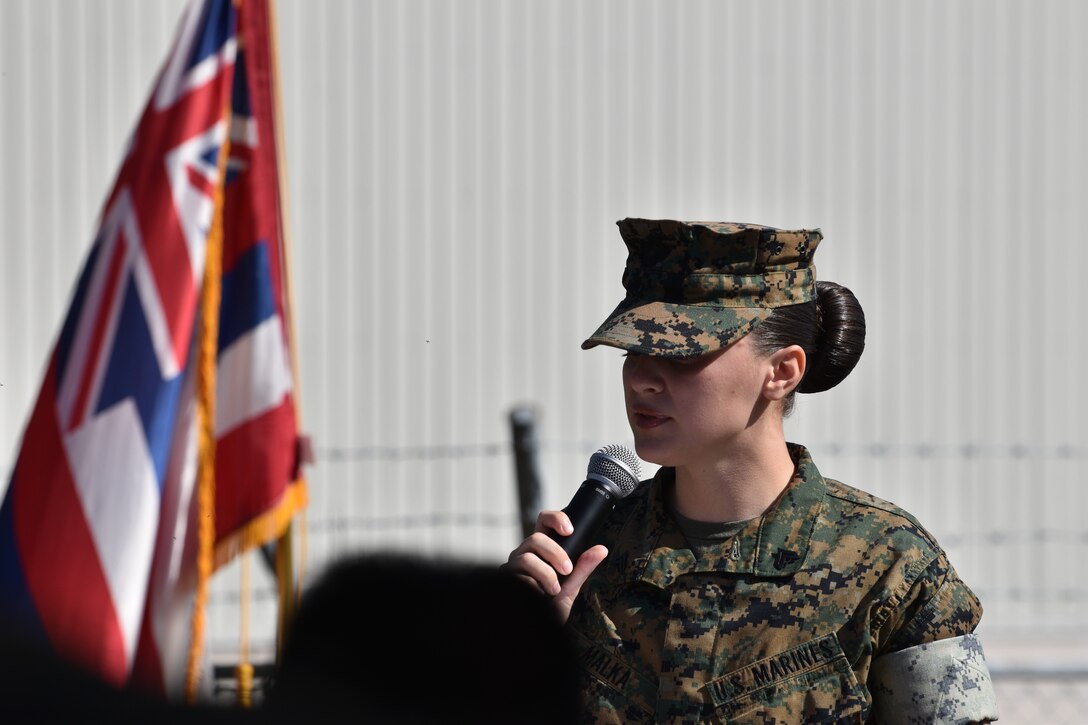Corporal Sarah Malka recounts the story of what transpired during Typhoon Tip in 1979 and led to the devastating fire, during the CATC Camp Fuji memorial ceremony, October 20, 2023. (U.S. Marine Corps photo by Song Jordan)