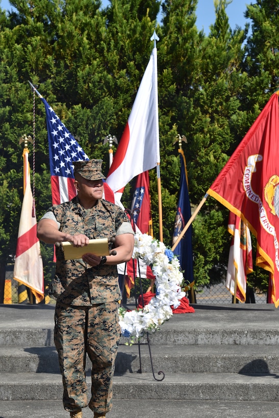 Sergeant Major Restituto Paz, Combined Arms Training Center, Camp Fuji's sergeant major, calls roll during the 1979 fire memorial ceremony, October 20, 2023. (U.S. Marine Corps photo by Song Jordan)