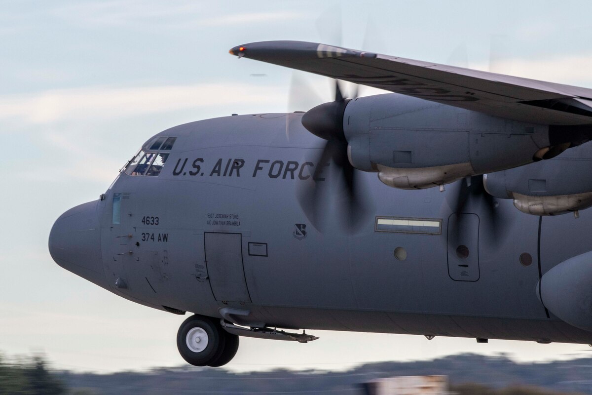 A plane takes off from the ground.
