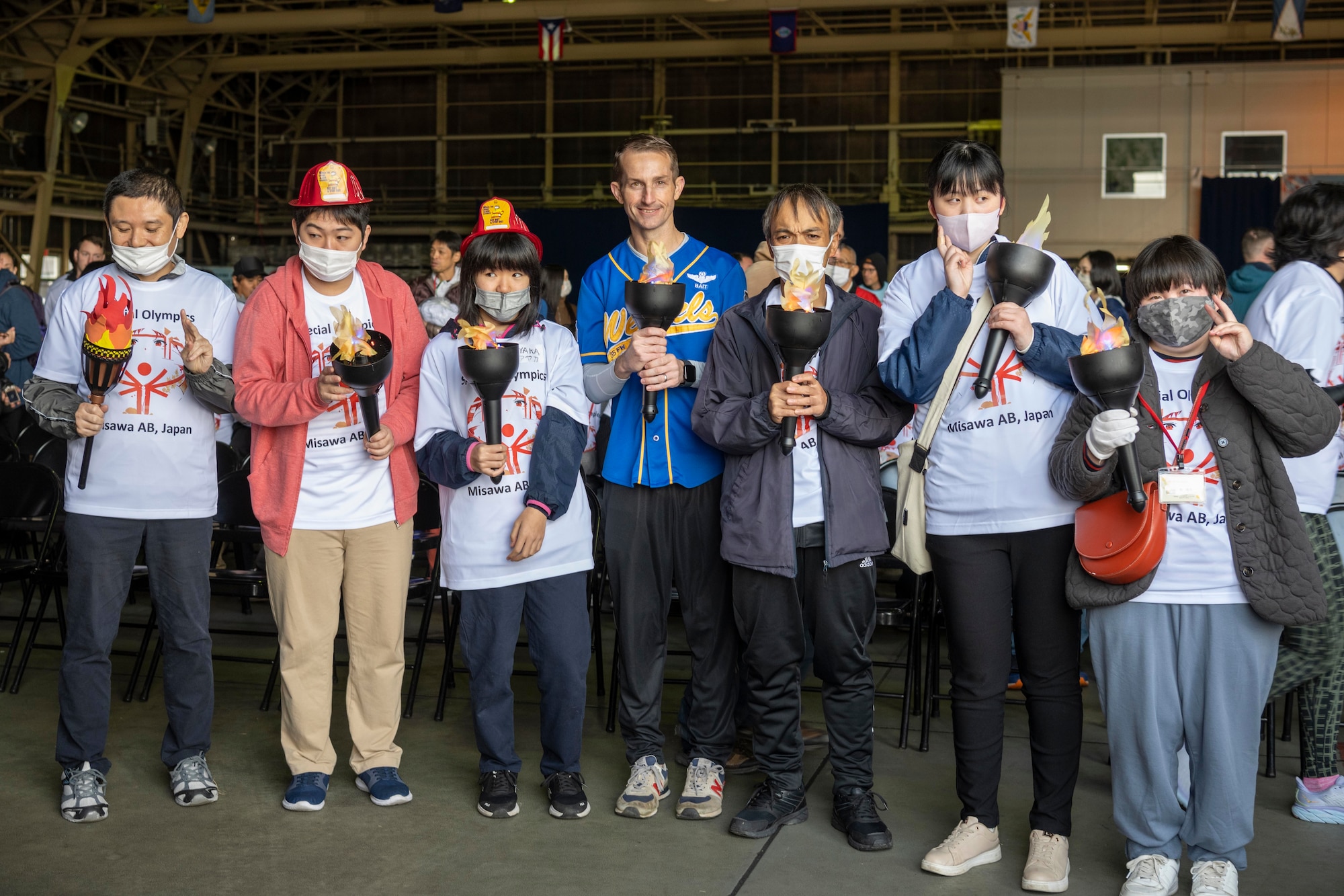 U.S. Air Force Col. Michael Richard, 35th Fighter Wing commander, poses for a photograph with athletes during the 2023 Misawa Special Olympics at Misawa Air Base, Japan.