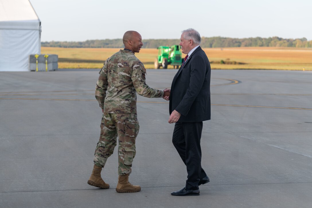 Arnold Engineering Development Complex Commander Col. Randel Gordon, left, greets Secretary of the Air Force Frank Kendall upon his arrival at Arnold Air Force Base, Tenn., Oct. 4, 2023. During his visit to Arnold, headquarters of AEDC, Kendall observed some base operations, toured several facilities and received overviews of current and planned AEDC test capabilities. (U.S. Air Force photo by Keith Thornburgh)