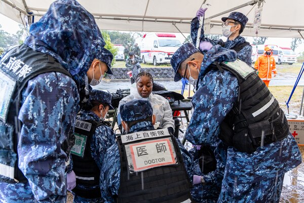 JMSDF Sailors treat USNMRTC Yokosuka Sailor during Big Rescue Kanagawa mass causality exercise