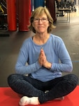 American Red Cross volunteer Connie Sullivan offers yoga instruction at Walter Reed National Military Medical Center.