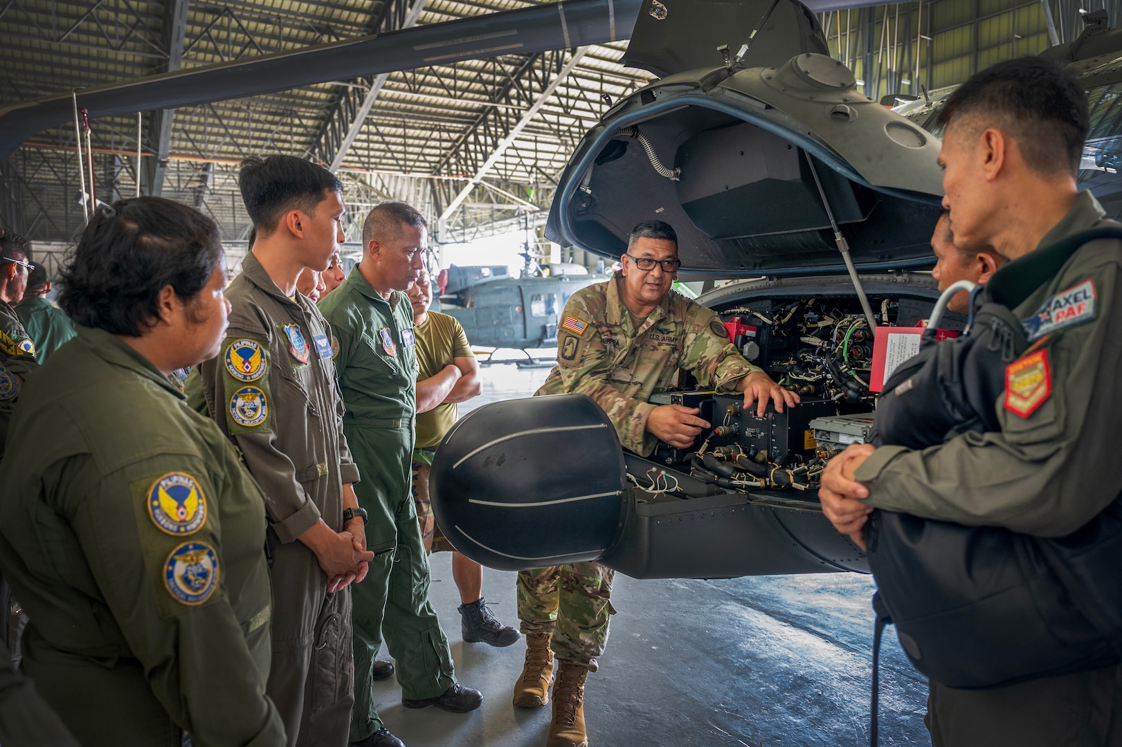 Hawaii Army National Guard 1st Sgt. Clayton Perreira, Charlie Company, 1st Battalion, 183rd Aviation Regiment commander, conducts a standardization subject matter expert exchange with the Philippine Air Force at Brigadier General Benito N. Ebuen Air Base, Lapu-Lapu City, Philippines, Sept. 27, 2023.