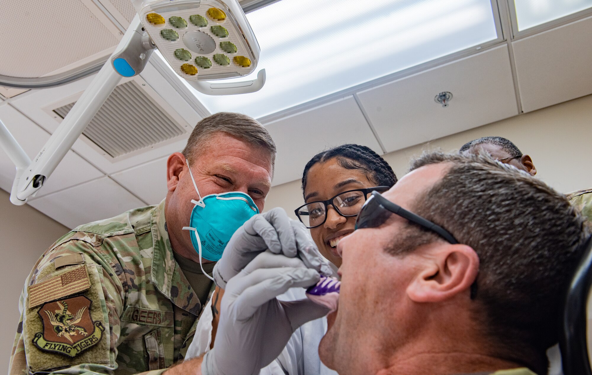 Airmen practice applying impressions and color staining a crown
