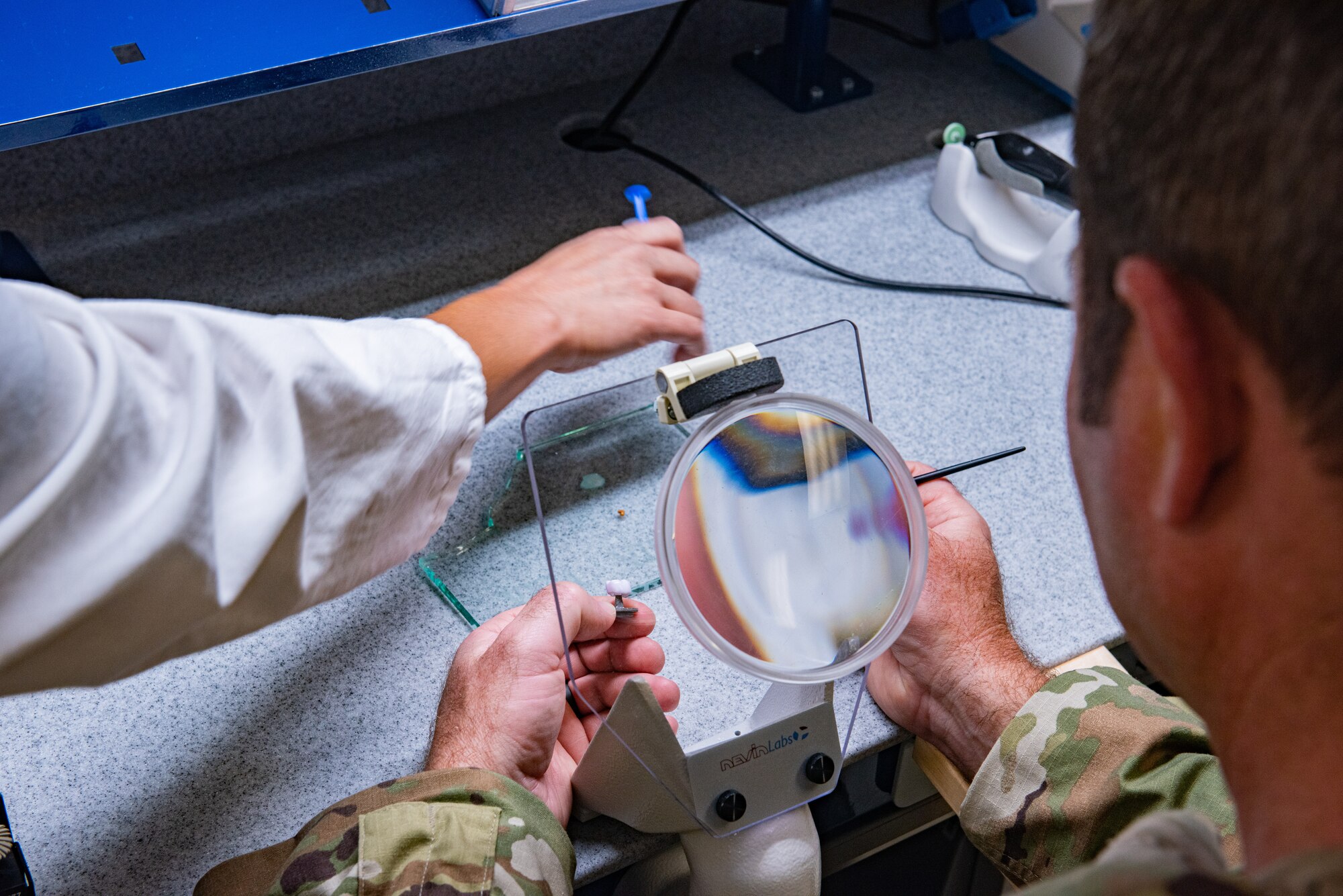 Airmen practice applying impressions and color staining a crown