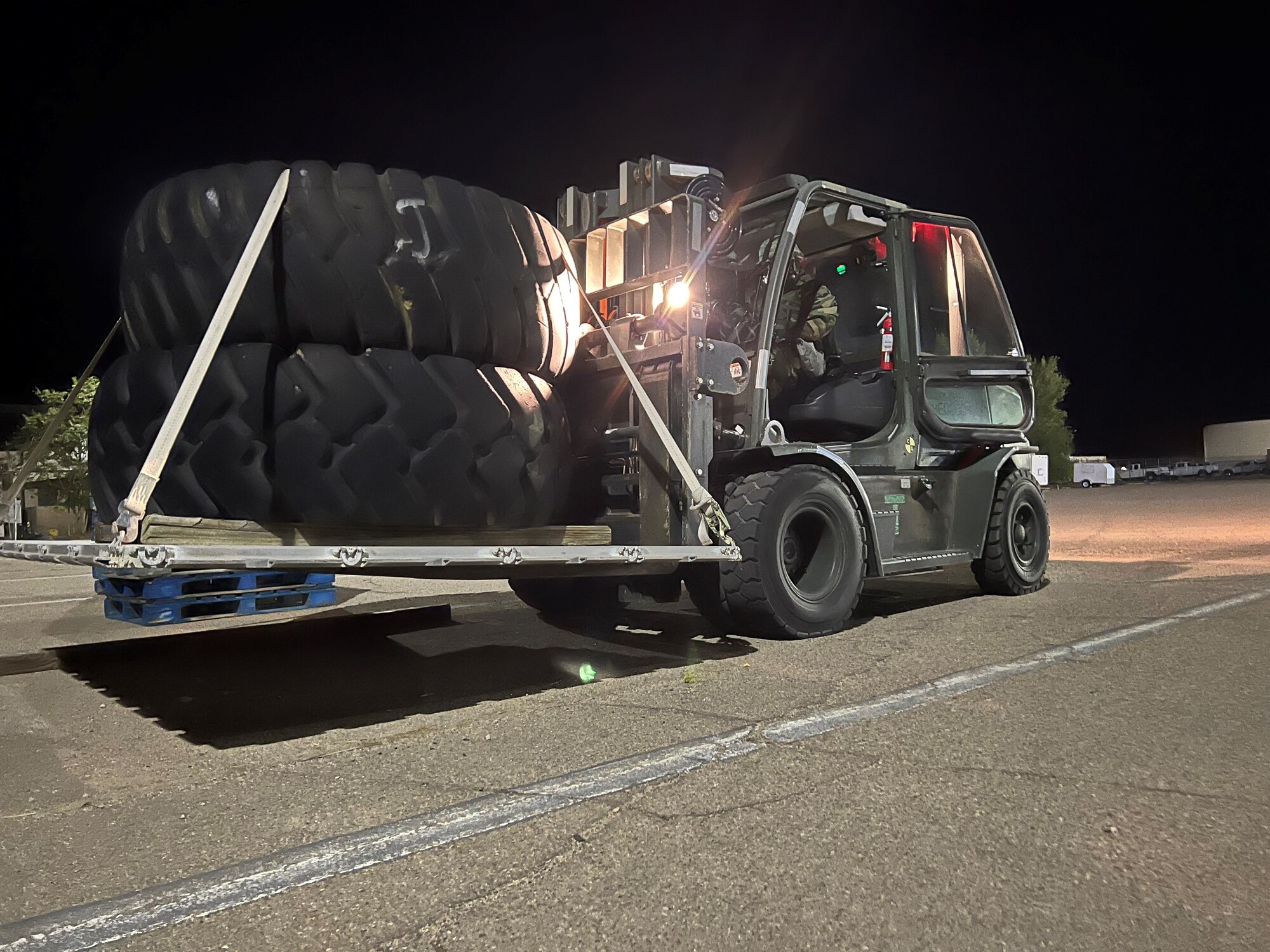 Forklift picks up a tire