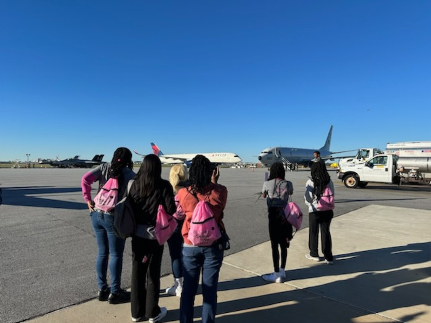 Pilots speak to children at an event