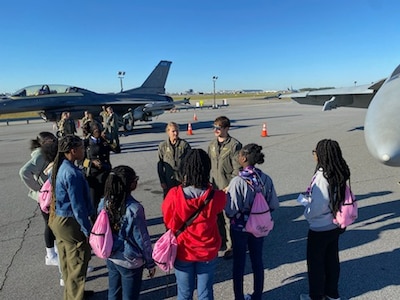 Pilots speak to children at an event