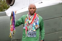 U.S. Army Reserve Master Sgt. Laroy Warren, G-1 Non-Commissioned Officer in Charge, IPPS-A Liaison, 85th U.S. Army Reserve Support Command, displays the medals he has earned competing in 5k and 10k races from March to October of this year, October 16, 2023.