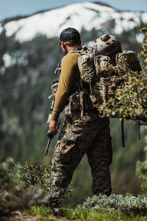 U.S. Marine Corps Staff Sgt. Michael Mullinix, a reconnaissance Marine with 4th Reconnaissance Battalion, gives a route brief during Mountain Training Exercise (MTX) 4-23 at Mountain Warfare Training Center (MWTC), Bridgeport, California, June 11, 2023. MTX ensures warfighter readiness and effectiveness in mountainous terrain. (U.S. Marine Corps photo by Lance Cpl. Justin J. Marty)
