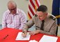 Col. Jeffrey Palazzini, district commander, Harry Brower Jr., mayor of the North Slope Borough, and Senator Dan Sullivan participated in a ceremonial signing of the Project Partnership Agreement for the Barrow Coastal Erosion Project at the district headquarters on Tuesday.
