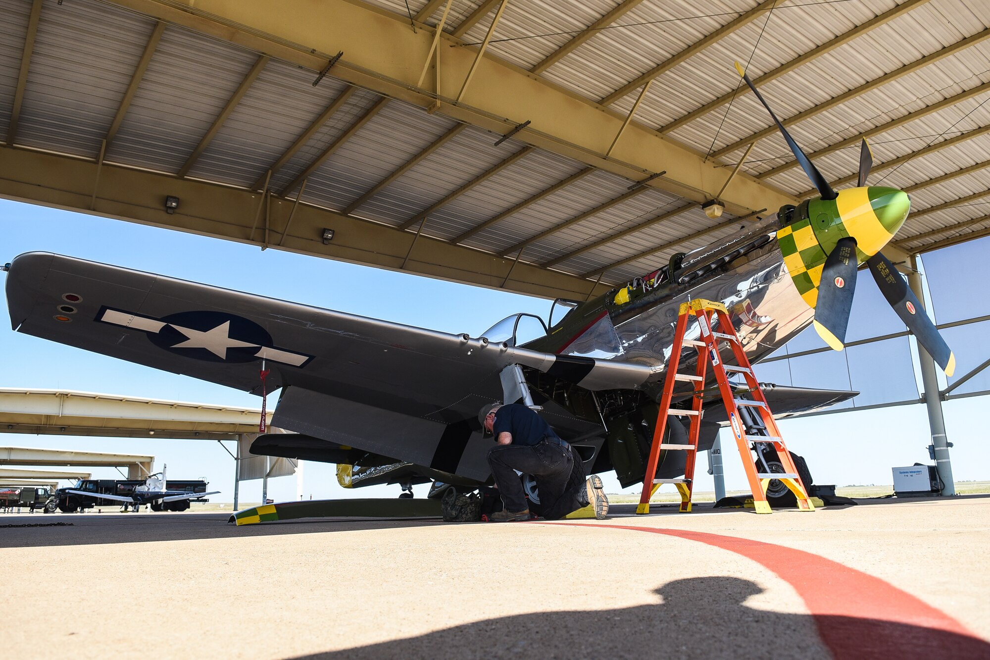 A P-51 Mustang sits on under the sun shades on October 18, 2023, at Sheppard Air Force Base, Texas.