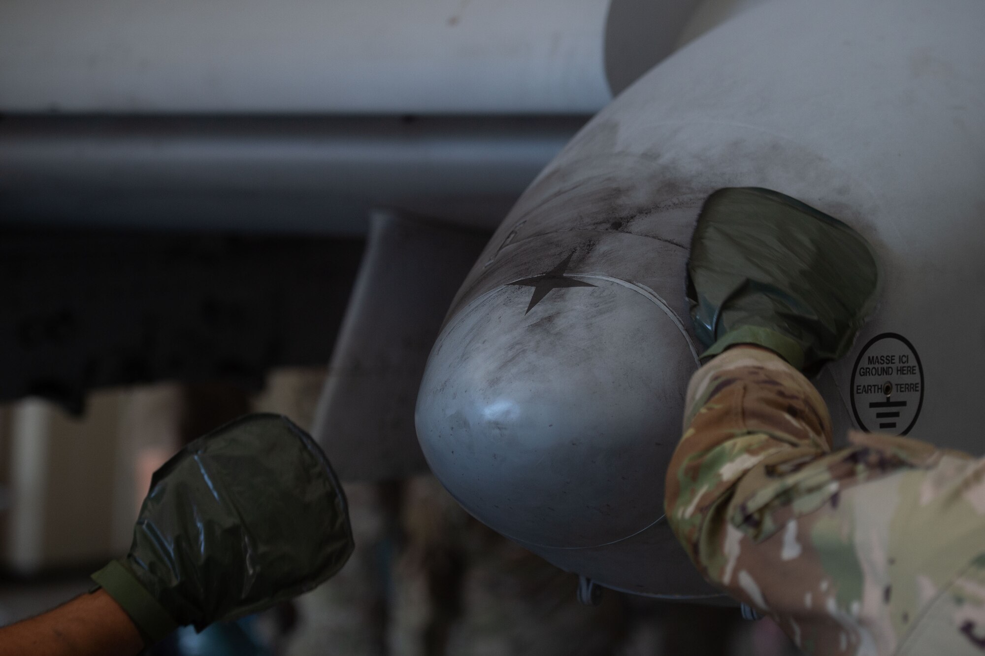 Airmen walk through step by step of decontaminating an Aircraft