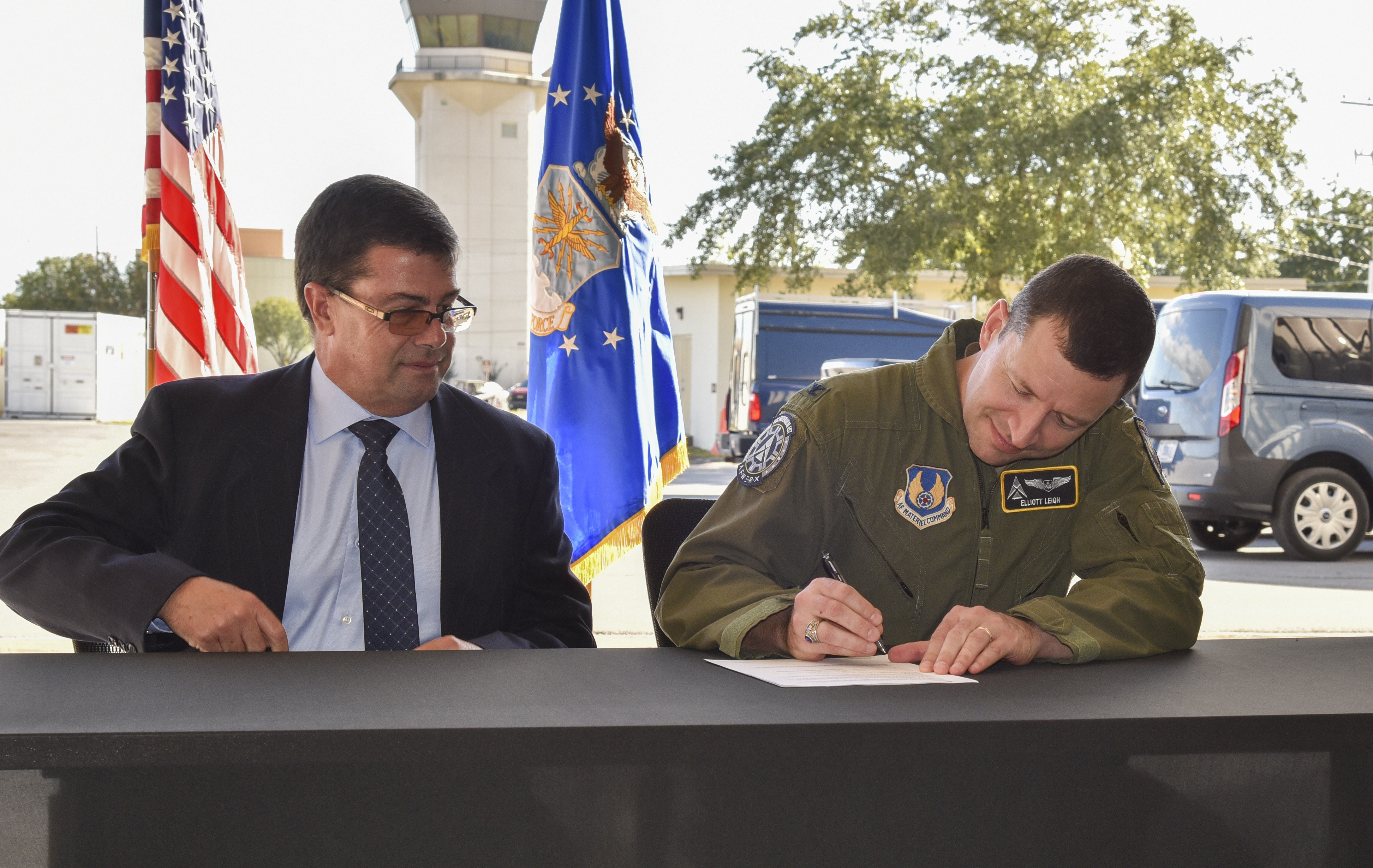 Col. Elliott Leigh, AFWERX director and chief commercialization officer for the Department of the Air Force, and John Maffei, the FAA’s acting director of Portfolio Management and Technology Development, sign the AFWERX and Federal Aviation Administration Memorandum of Understanding at Duke Field, Florida, Oct. 25, 2023.