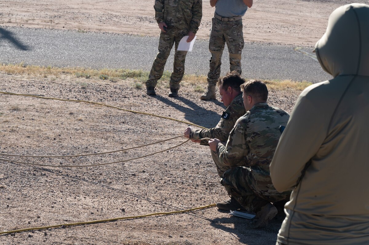 Combat Rescue Officer candidates participate in a Phase II training exercise and pull on ropes outside of Bama Park at Davis-Monthan Air Force Base, Ariz., Oct. 16, 2023. Candidates’ dexterity was assessed during the training exercise. (U.S. Air Force photo by Airman 1st Class Robert Allen Cooke III)