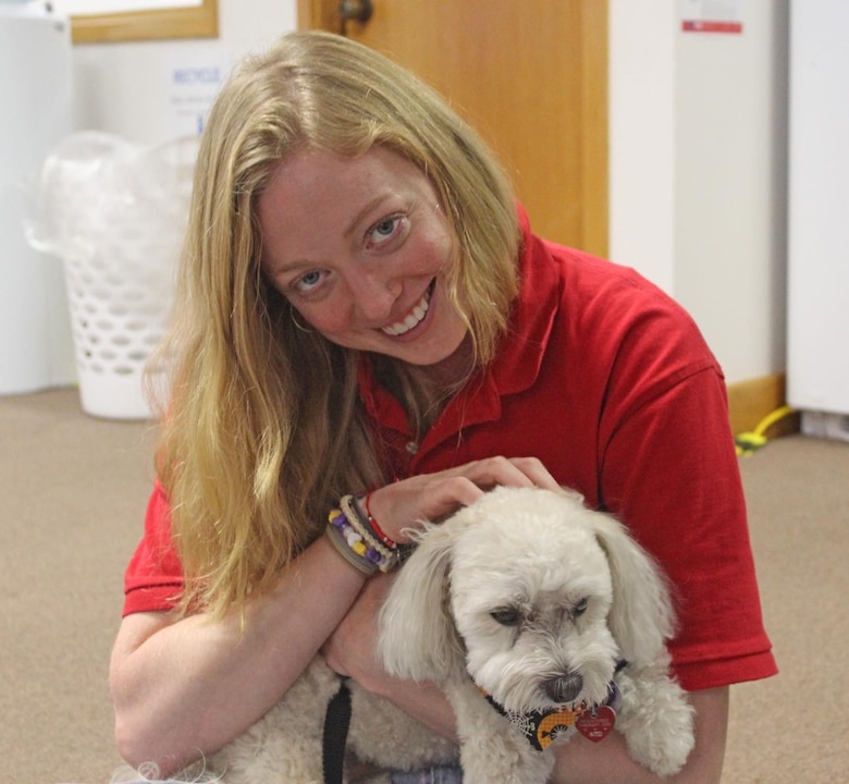 Lady in red USACE shirt with therapy dog.