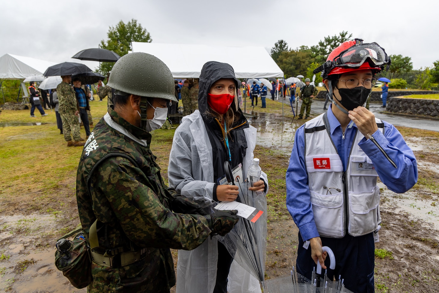JGSDF Solider and Medical Service Unit of Yokosuka physician escort a simulated causality from USNMRTC Yokosuka to an emergency tent during Big Rescue Kanagawa exercise