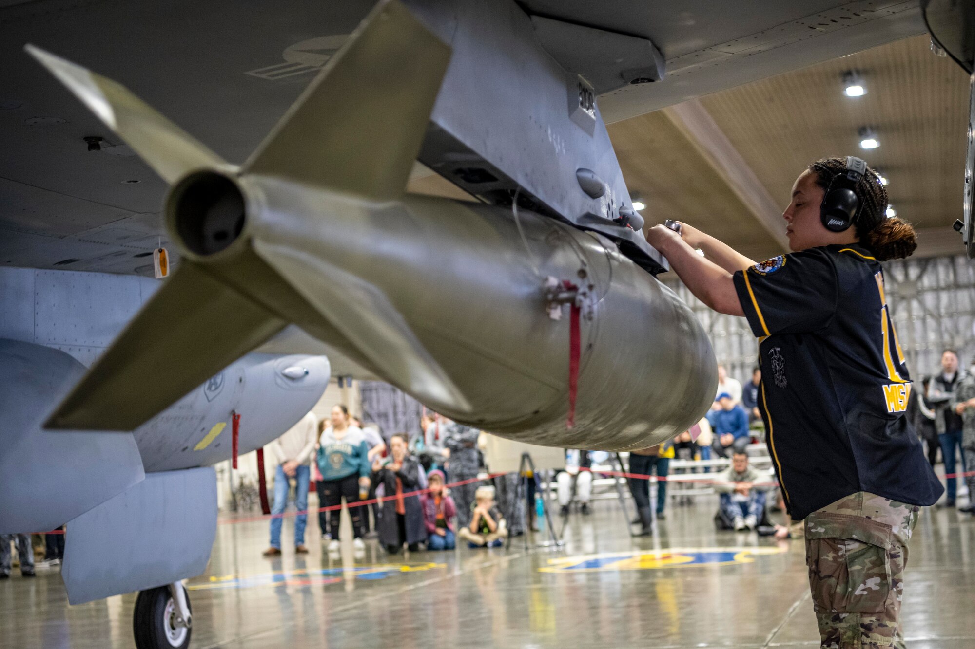 A U.S. Air Force Airman assigned to the 14th Fighter Generation Squadron tightens a bolt during a loading demonstration at Misawa Air Base, Japan, Oct. 20, 2023.