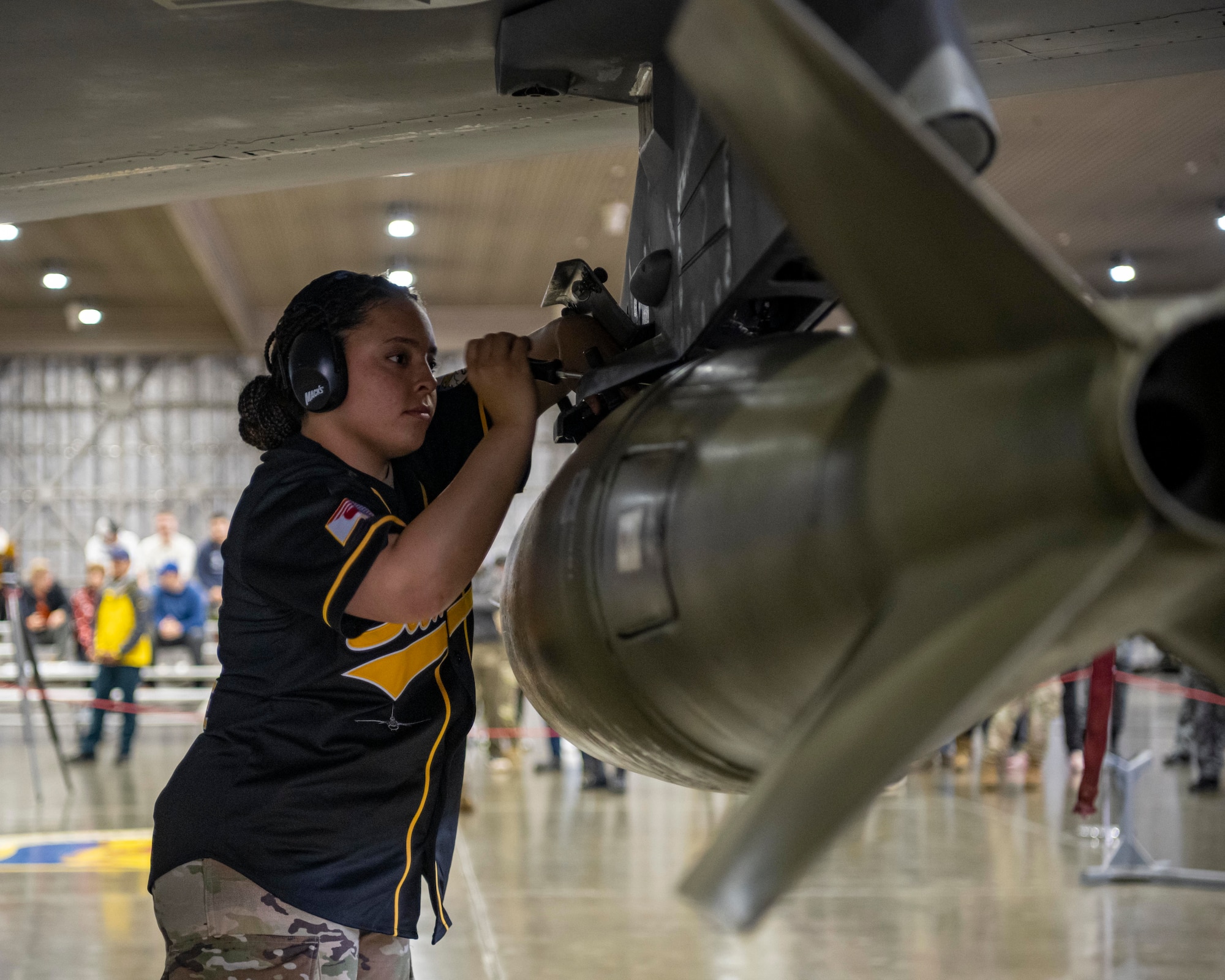A U.S. Air Force Airman assigned to the 14th Fighter Generation Squadron (FGS) tightens a bolt during a loading demonstration at Misawa Air Base, Japan, Oct. 20, 2023.
