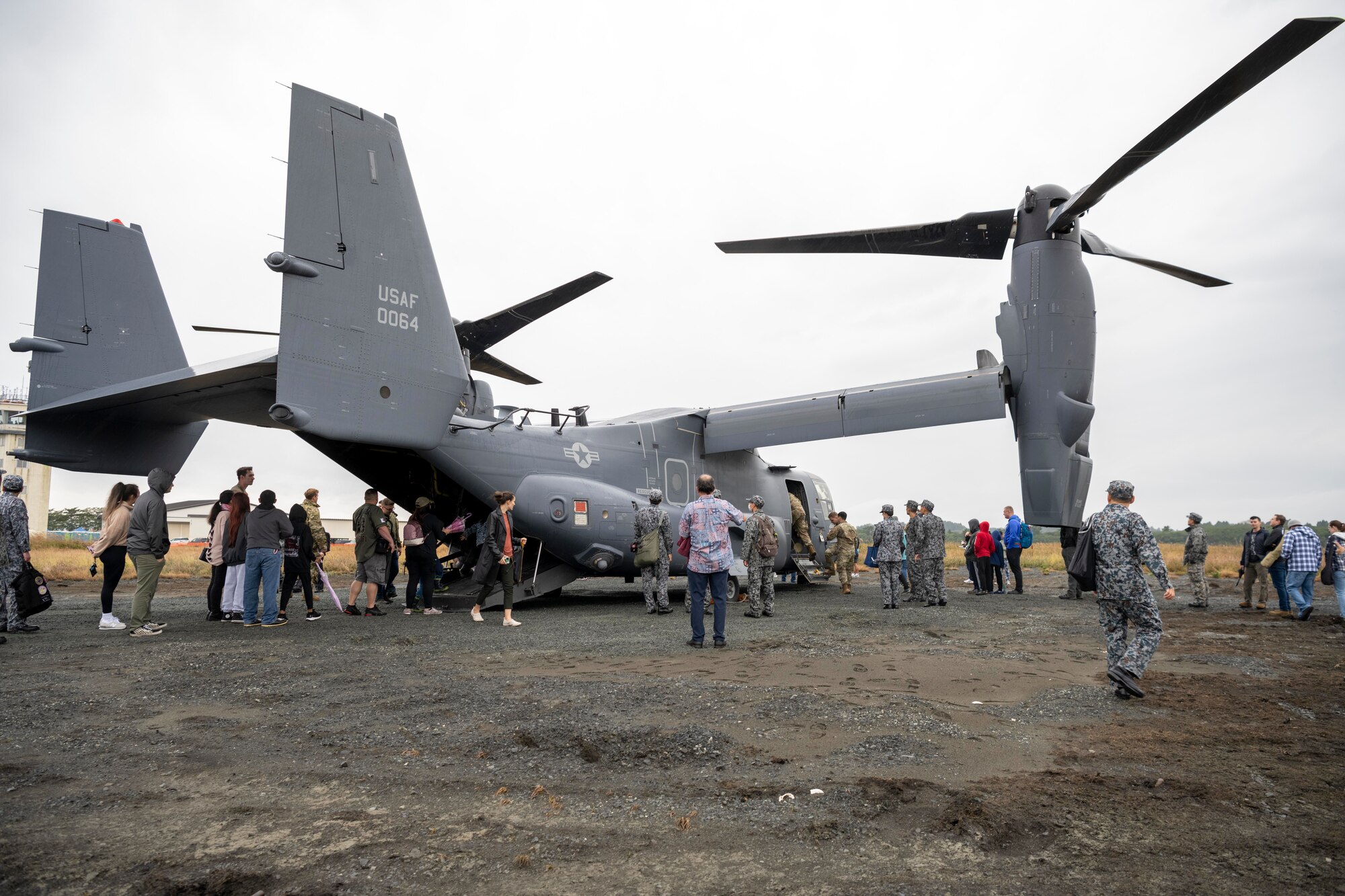 Attendees wait in line to tour a CV-22 Osprey during Misawa Range Day at Draughn Range, Japan, Oct. 20, 2023.